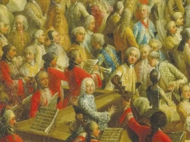The image shows a poster of J.S. Bach's "A Life in Music" featuring a group of people playing...