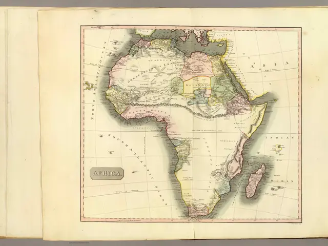 The image shows an open book with a map of Africa on it. The map is detailed and shows the various...