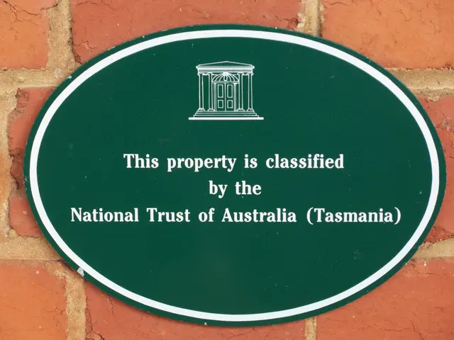 The image shows a green plaque on a brick wall that reads "This property is classified by the...