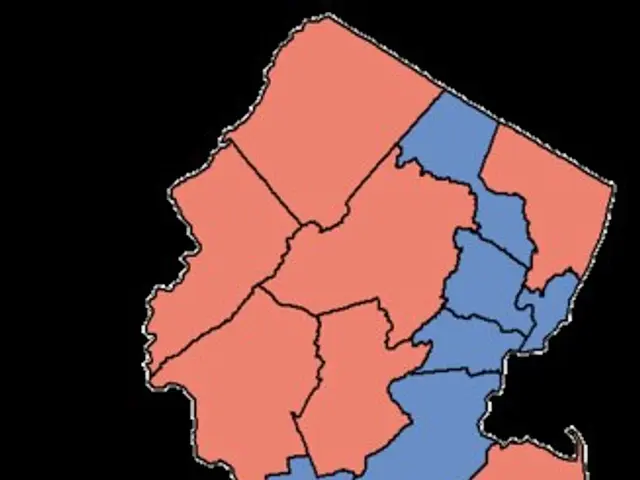The image shows a map of the state of New Jersey with the counties highlighted in red and blue,...
