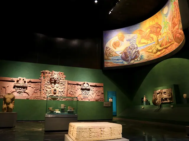 The image shows a room filled with lots of different types of artifacts, including sculptures on...