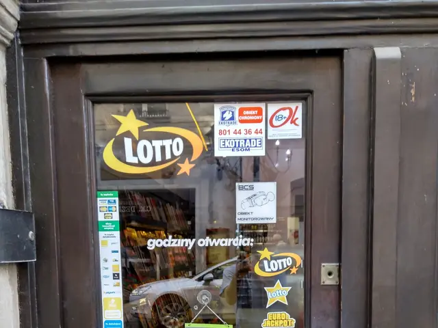 The image shows a store front with a glass door adorned with stickers and a sign that reads...