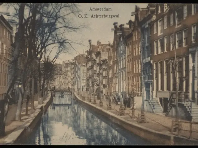 The image shows an old photo of a canal in Amsterdam, Netherlands, with water, trees, buildings...