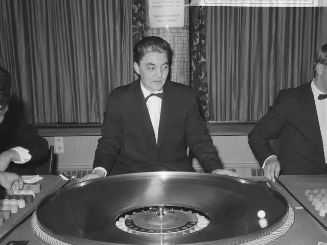 The image shows three men in tuxedos playing roulette at a casino table. The table is in the center...