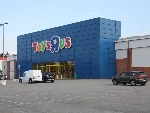 The image shows a Toys R Us store with cars parked in front of it, surrounded by buildings, street...