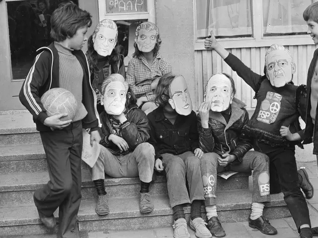 The image shows a group of children sitting on the steps of a building with masks on their faces....