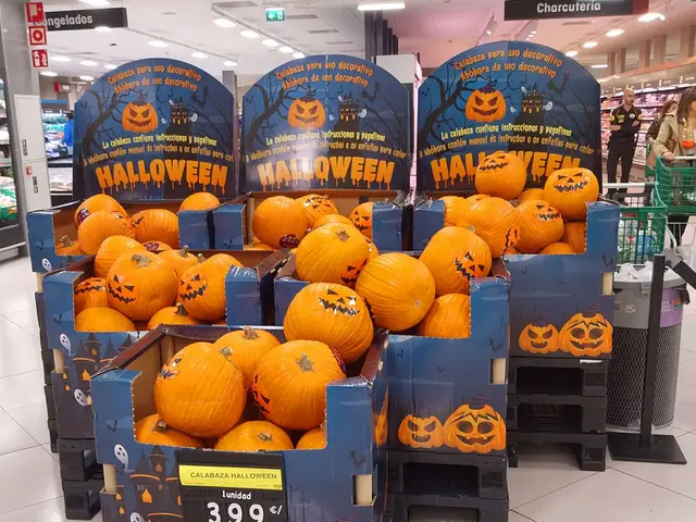 The image shows a store filled with lots of pumpkins on display. There are cardboard boxes with...