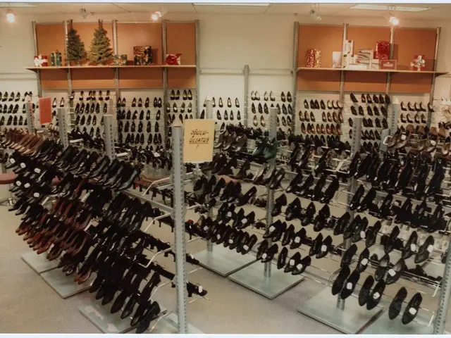 The image shows a shoe store filled with lots of different types of shoes arranged in racks, with a...