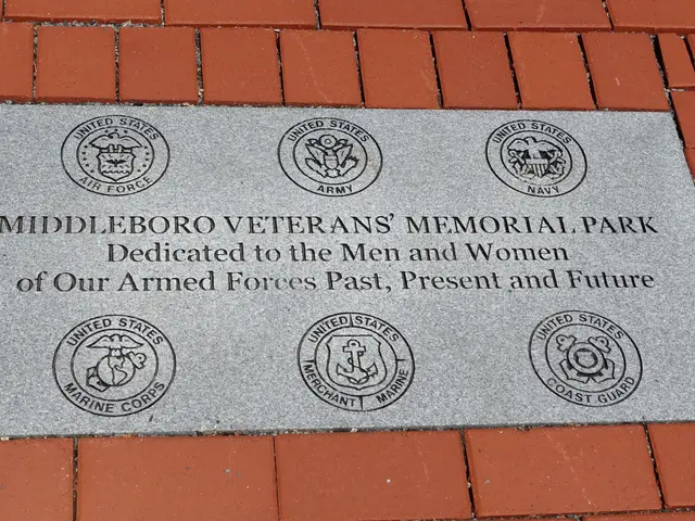 The image shows a brick walkway with a plaque on it that reads "Middleboro Veterans Memorial Park"....
