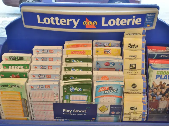 The image shows a blue display case filled with lots of lottery tickets in front of a glass window,...