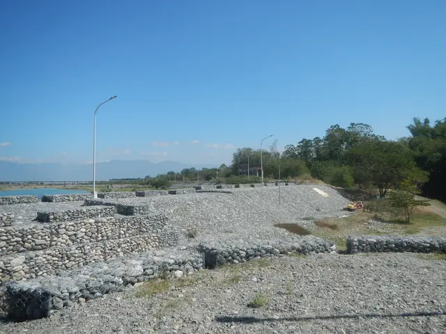 The image shows the ruins of the ancient city of Ephesus, Greece, with stones, grass, plants,...