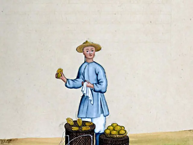 The image shows a man wearing a blue dress and a straw hat, holding a bunch of bananas in one hand...
