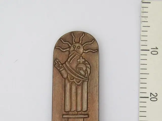 The image shows a wooden bookmark with the word "Tallinn" on it next to a ruler, which is placed on...