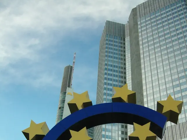 The image shows the euro sign in front of the European Central Bank (ECB) headquarters in...
