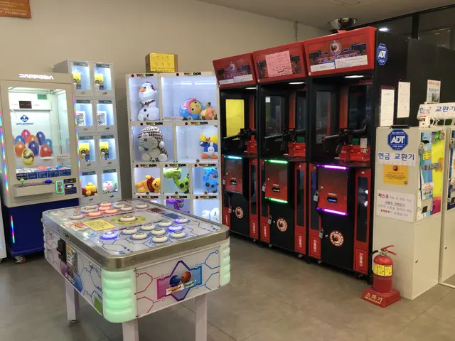 The image shows a room filled with lots of different types of arcade machines, including a table...