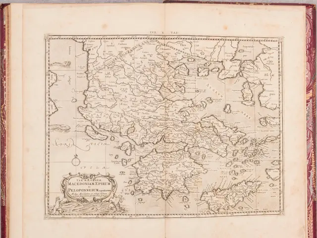 The image shows an open book with a map of Greece on it. The map is detailed and shows the various...