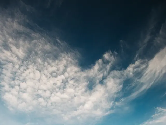 The image shows a stunning view of Glacier National Park in Montana, with a large body of water in...