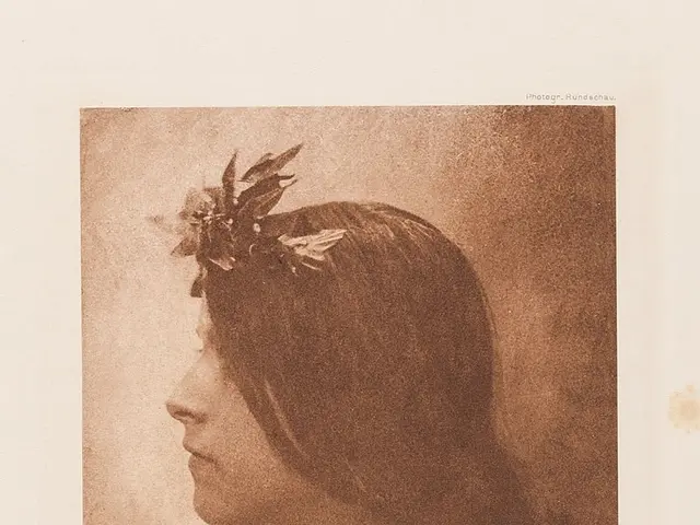 The image shows an old photo of a woman with a flower crown on her head, her face illuminated by...
