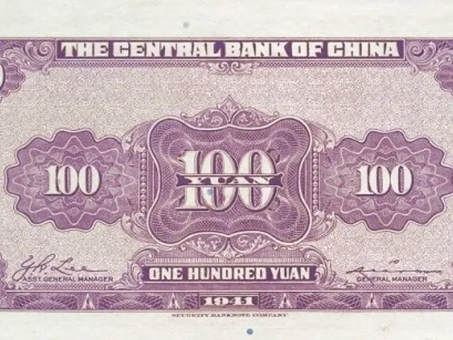 The image shows a 1941 100 Yuan banknote from the Central Bank of China. It is a paper currency...