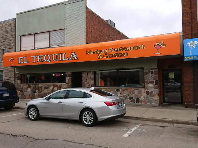 The image shows El Tequila Mexican Restaurant & Cantina, with cars on the road in front of it. The...