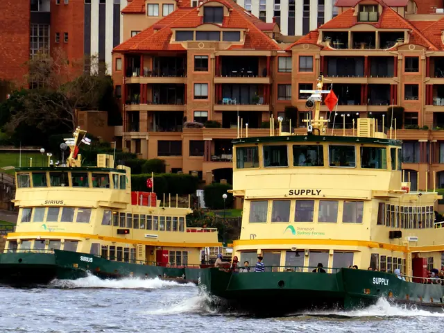 The image shows two large yellow and green boats traveling down a river, with people on board. In...