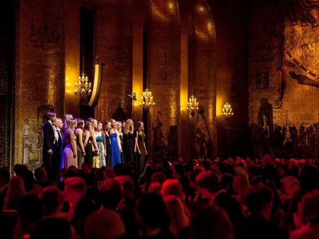 The image shows a group of people standing on top of a stage at the Royal Opera House in London....