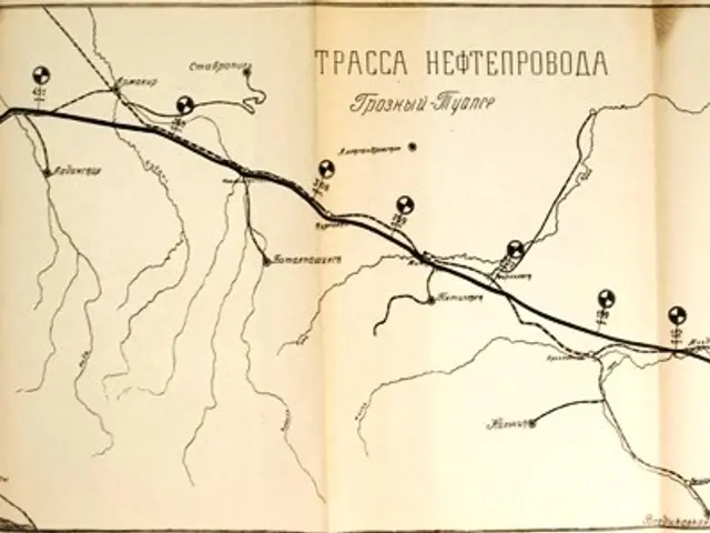 The image shows an open book with a map on it. The map is detailed and shows the various roads and...