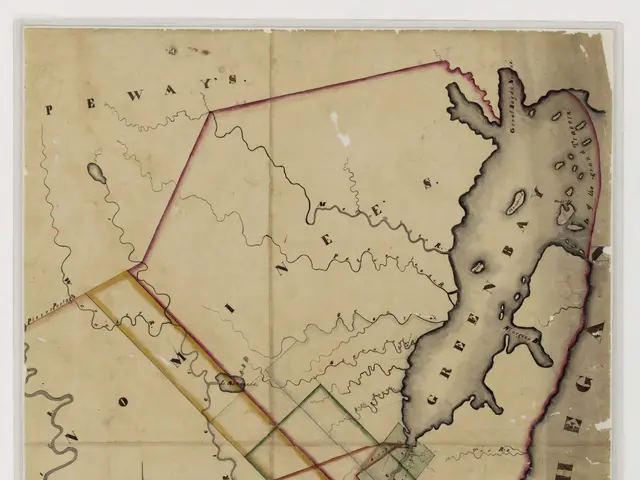 The image shows a map of the city of New York with a red line in the middle of it, set against a...