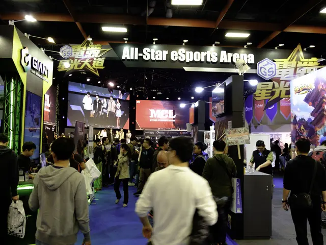 The image shows a large group of people standing in front of a booth at an all-star esports arena....
