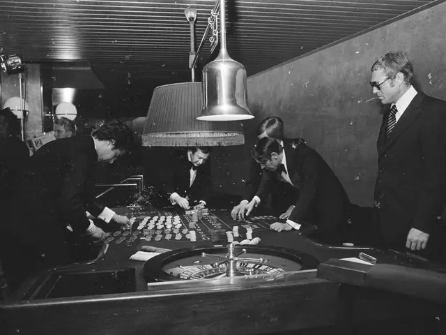 The image shows a group of men playing roulette in a casino. They are wearing blazers, ties, and...