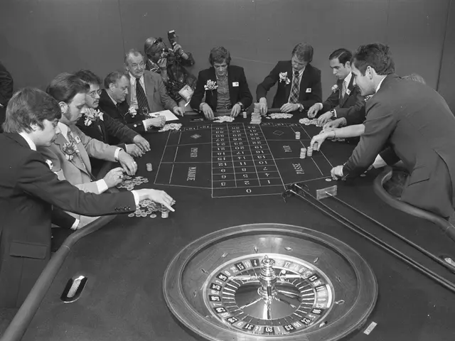 The image shows a group of men sitting around a roulette table in a casino. They are wearing...