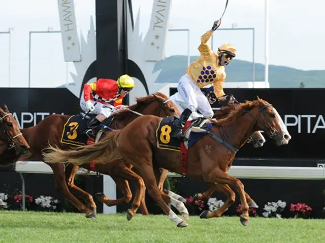 The image shows two jockeys on horses racing down a track, wearing helmets and goggles. The track...