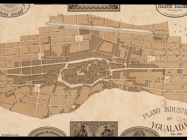 The image shows an old map of the city of Yucatan, Mexico, with a black border around it. The map...