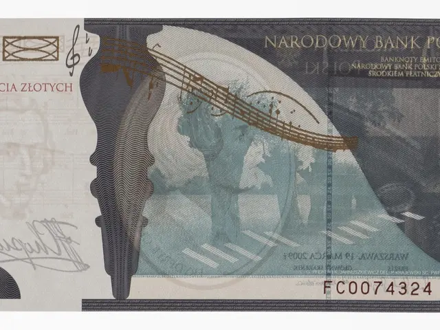 The image shows a Polish 20 zloty banknote with a picture of a man playing a guitar on it. The note...