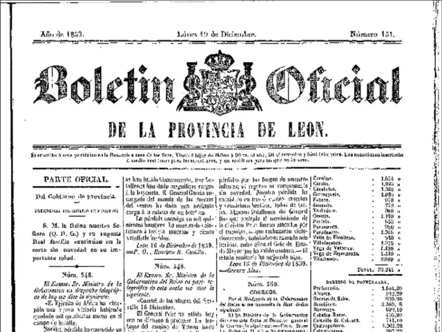 The image shows the front page of a newspaper with a black and white image of a man in a suit and...