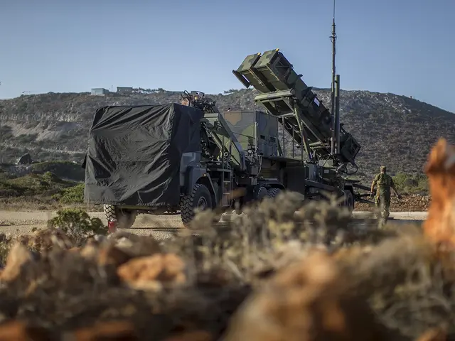 The image shows a military truck with a missile on the back of it driving down a dirt road...