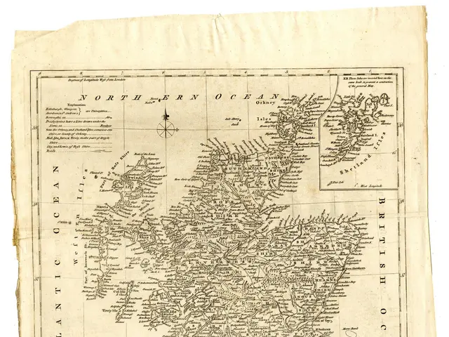 The image shows an old map of Scotland and the British Isles on a piece of paper. The map is...