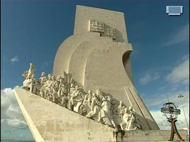 The image shows a monument to the discoveries in Lisbon, Portugal. It is a large monument with...