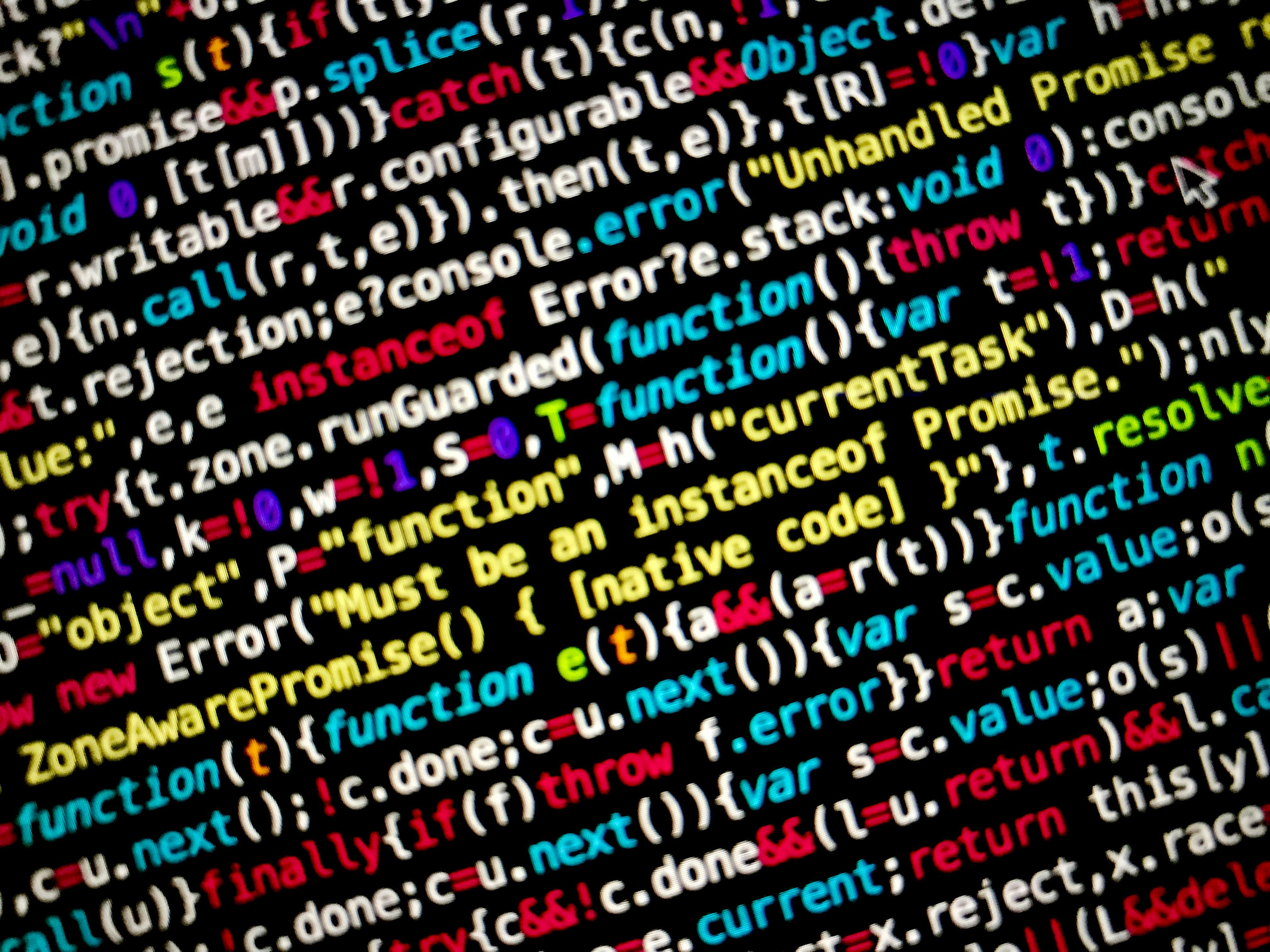 Photograph illustrates: Illustrative image displaying an individual engaging in hacking activities on a computer screen. Trump Administration's Assault on Harvard Spans Over Several Months: A Chronology of Conflict