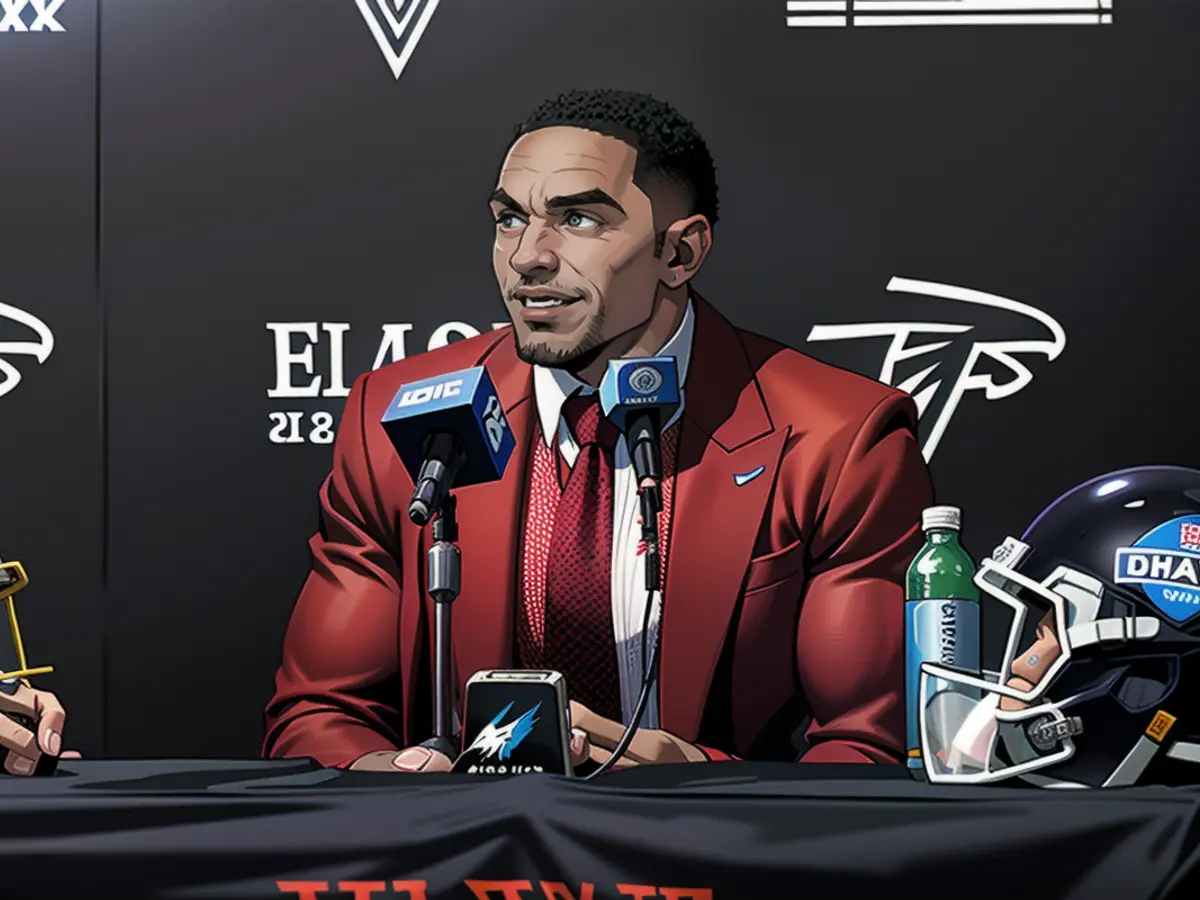 Michael Penix Jr., the new quarterback for the Falcons, speaks to the press. New Falcons quarterback Michael Penix Jr. talks to the media.