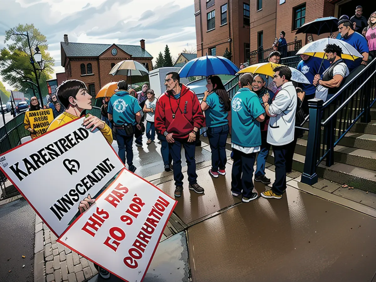 People assembled in front of a courthouse prior to a recent preliminary trial for Karen Read in Dedham, Massachusetts' Norfolk County Superior Court. Protesters gather outside the courthouse during a recent pretrial hearing for Karen Read at Norfolk County Superior Court in Dedham, Massachusetts.