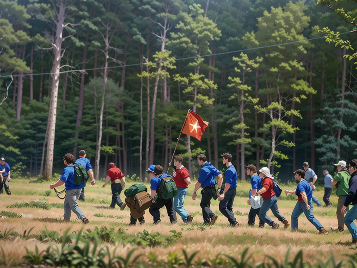 Carrying the flag, we headed through woods and meadows towards the e-car factory